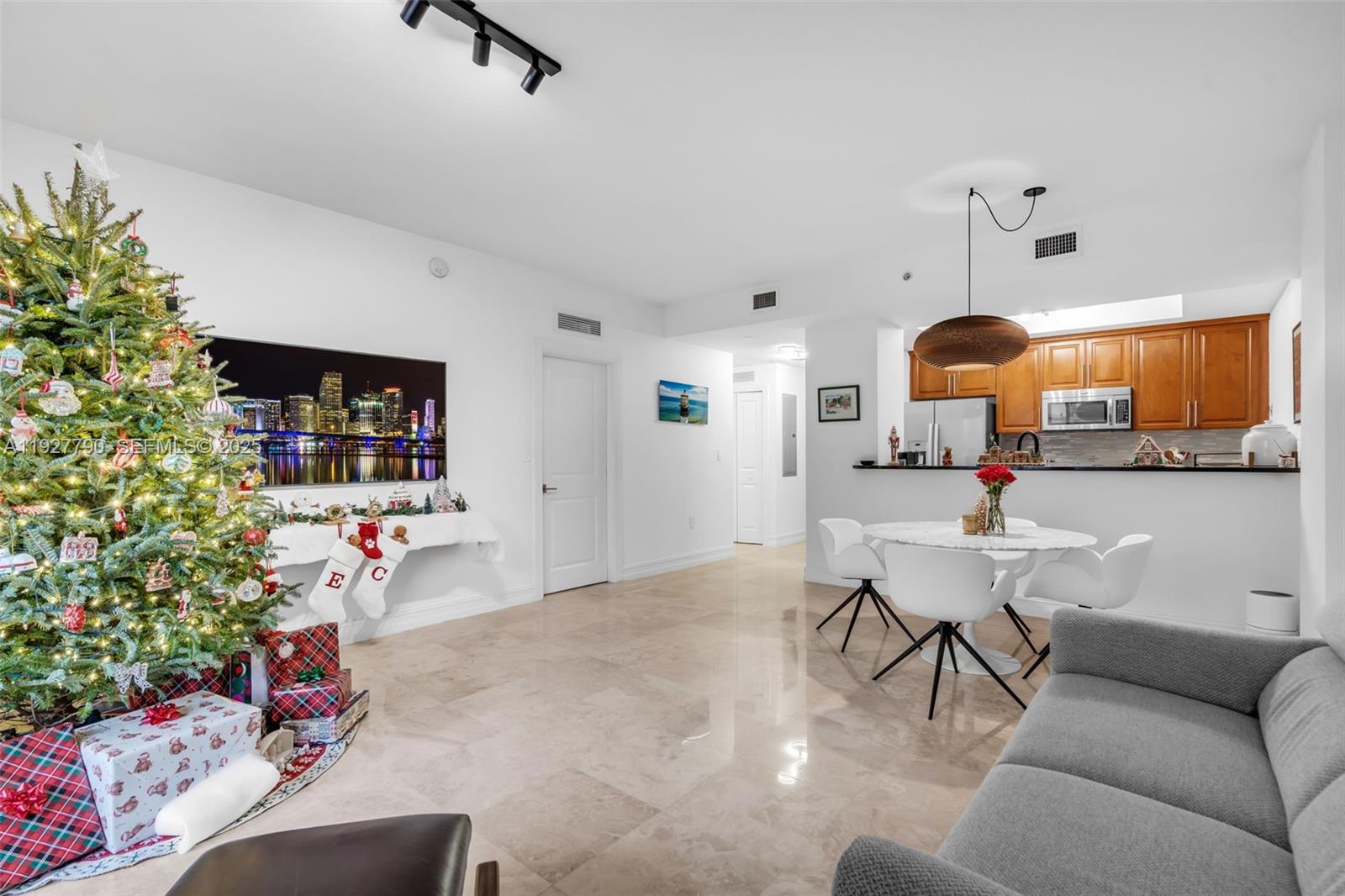 1650 Galiano Street, Unit 311 Coral Gables, FL 33134 - Photo 6 of 32 a living room with furniture and kitchen view