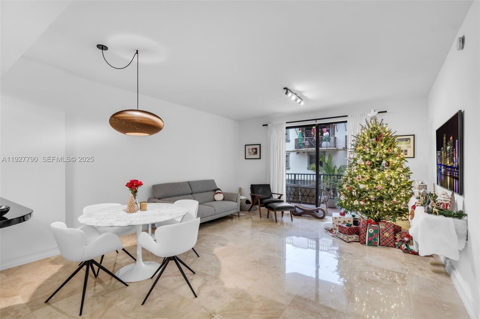 1650 Galiano Street, Unit 311 Coral Gables, FL 33134 - Photo 8 of 32 a living room with furniture potted plant and large window