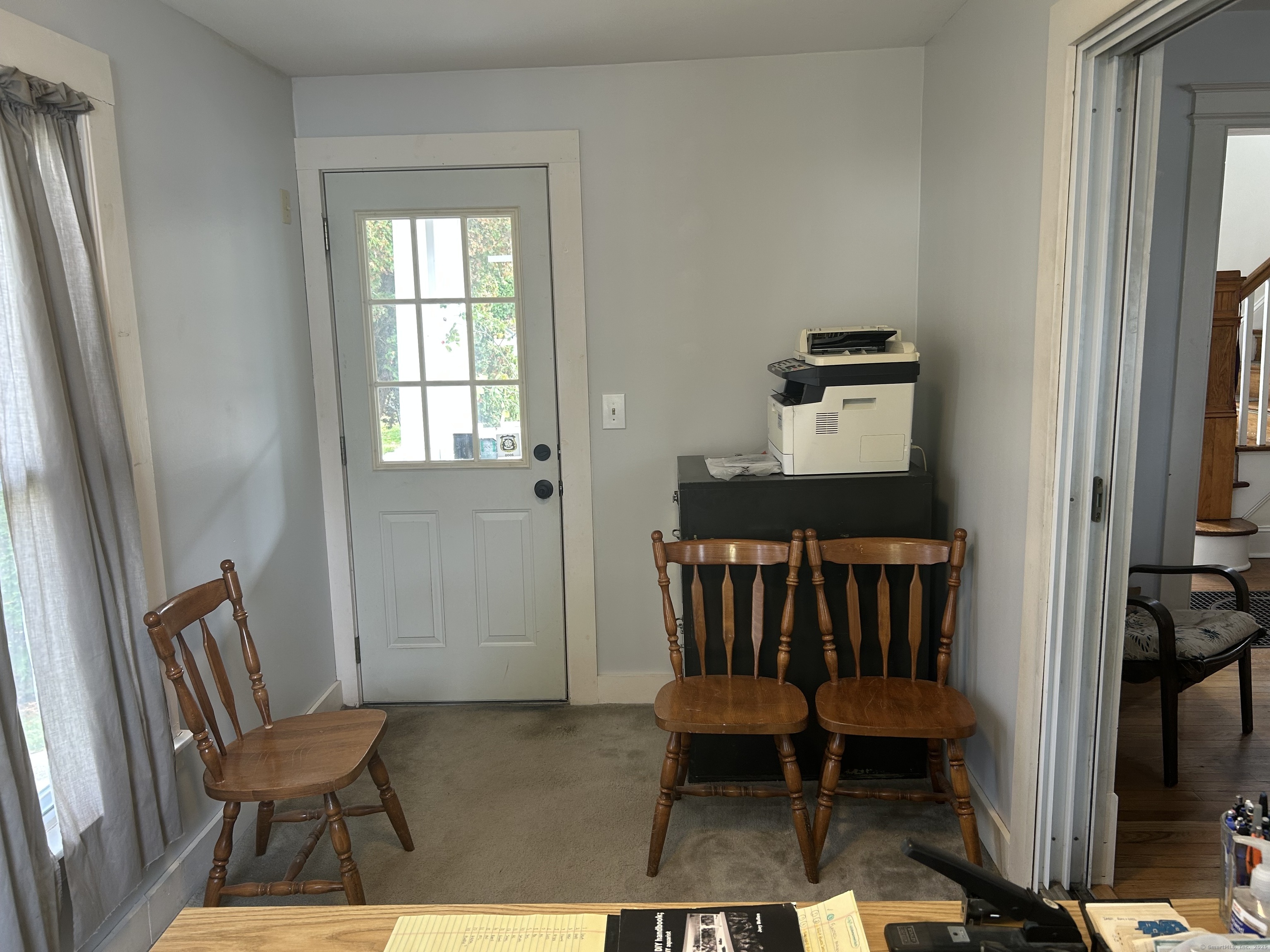 21 Acushnet Street Naugatuck, CT 06770 - Photo 13 of 27 a bedroom with a chair and wooden floor
