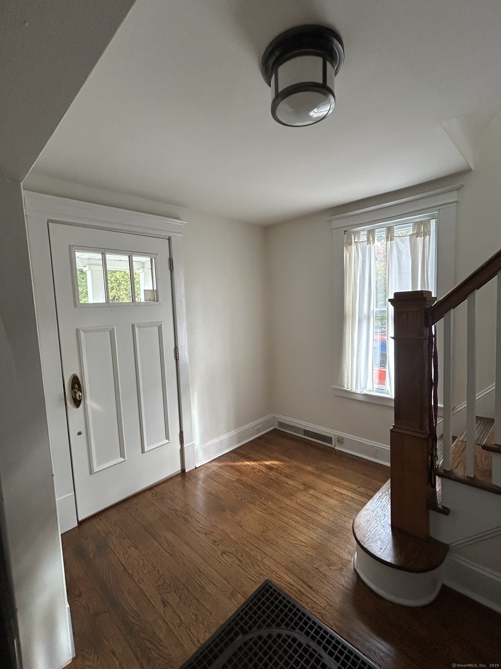 21 Acushnet Street Naugatuck, CT 06770 - Photo 2 of 27 a view of an empty room with window