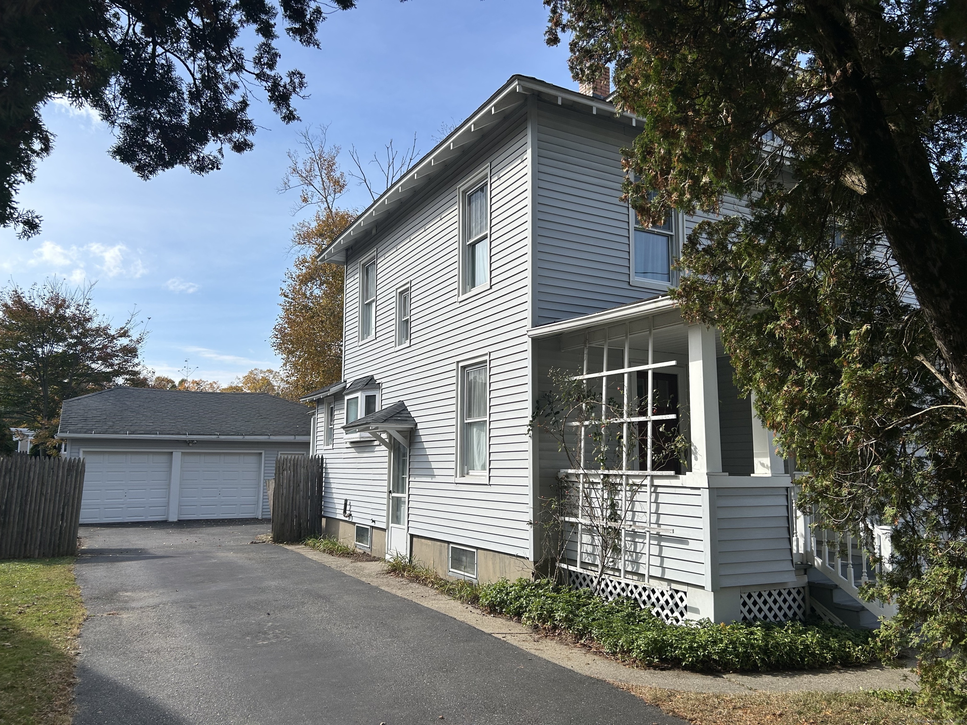 21 Acushnet Street Naugatuck, CT 06770 - Photo 22 of 27 a front view of a house with a garage