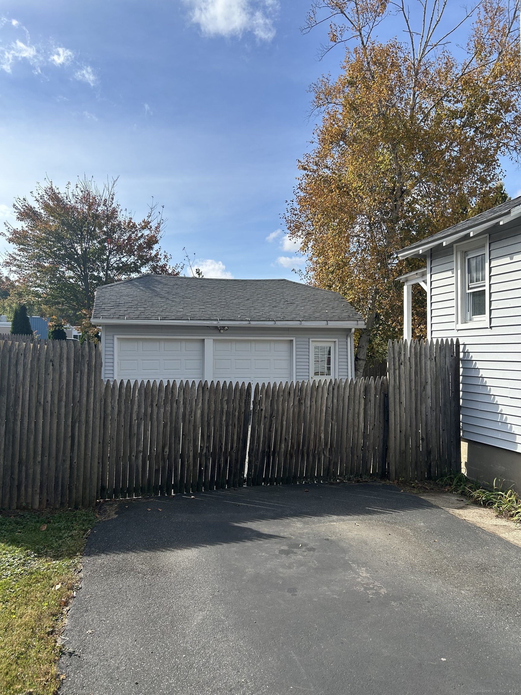 21 Acushnet Street Naugatuck, CT 06770 - Photo 23 of 27 a view of backyard with wooden fence