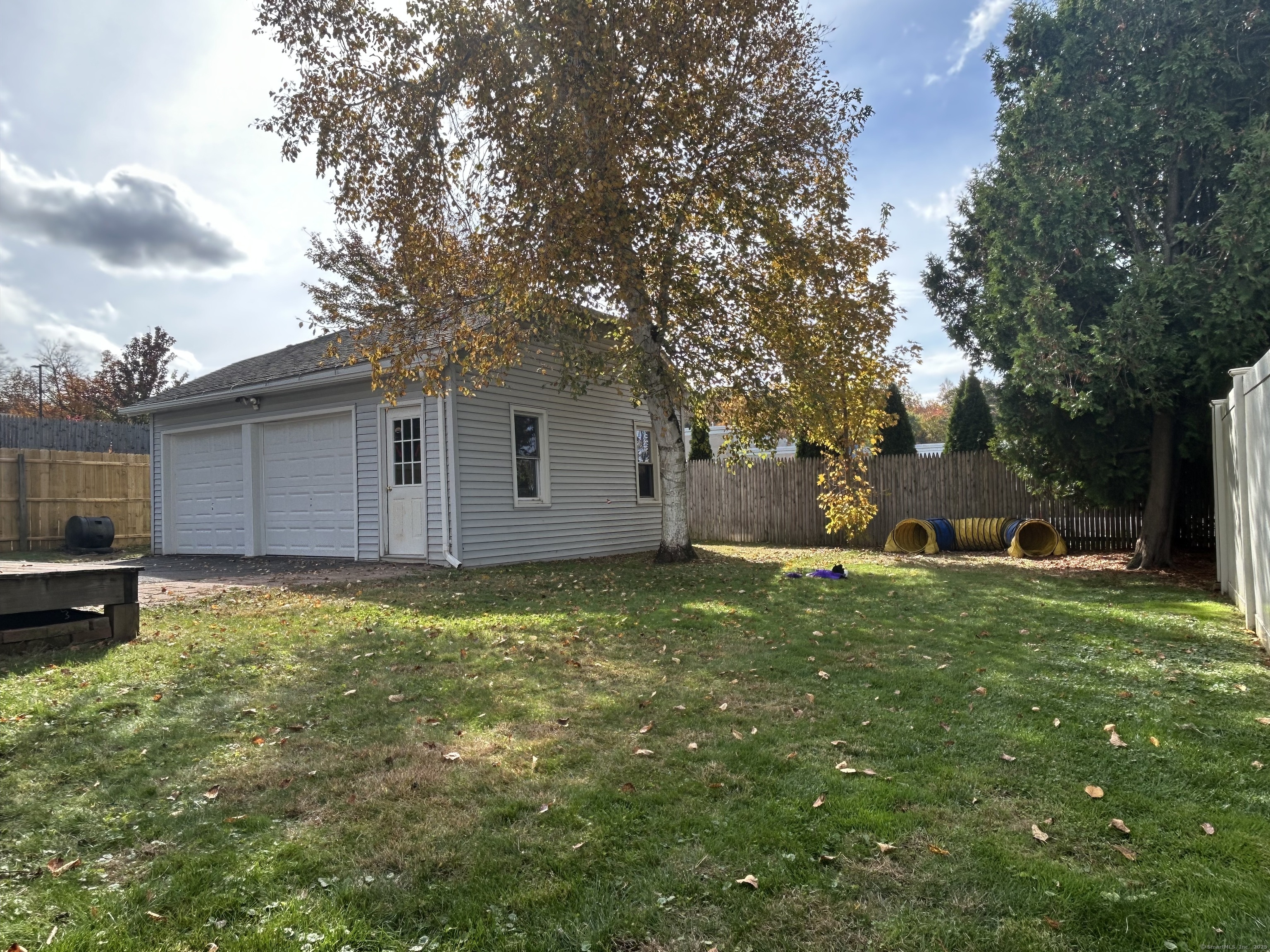 21 Acushnet Street Naugatuck, CT 06770 - Photo 27 of 27 a backyard of a house with table and chairs