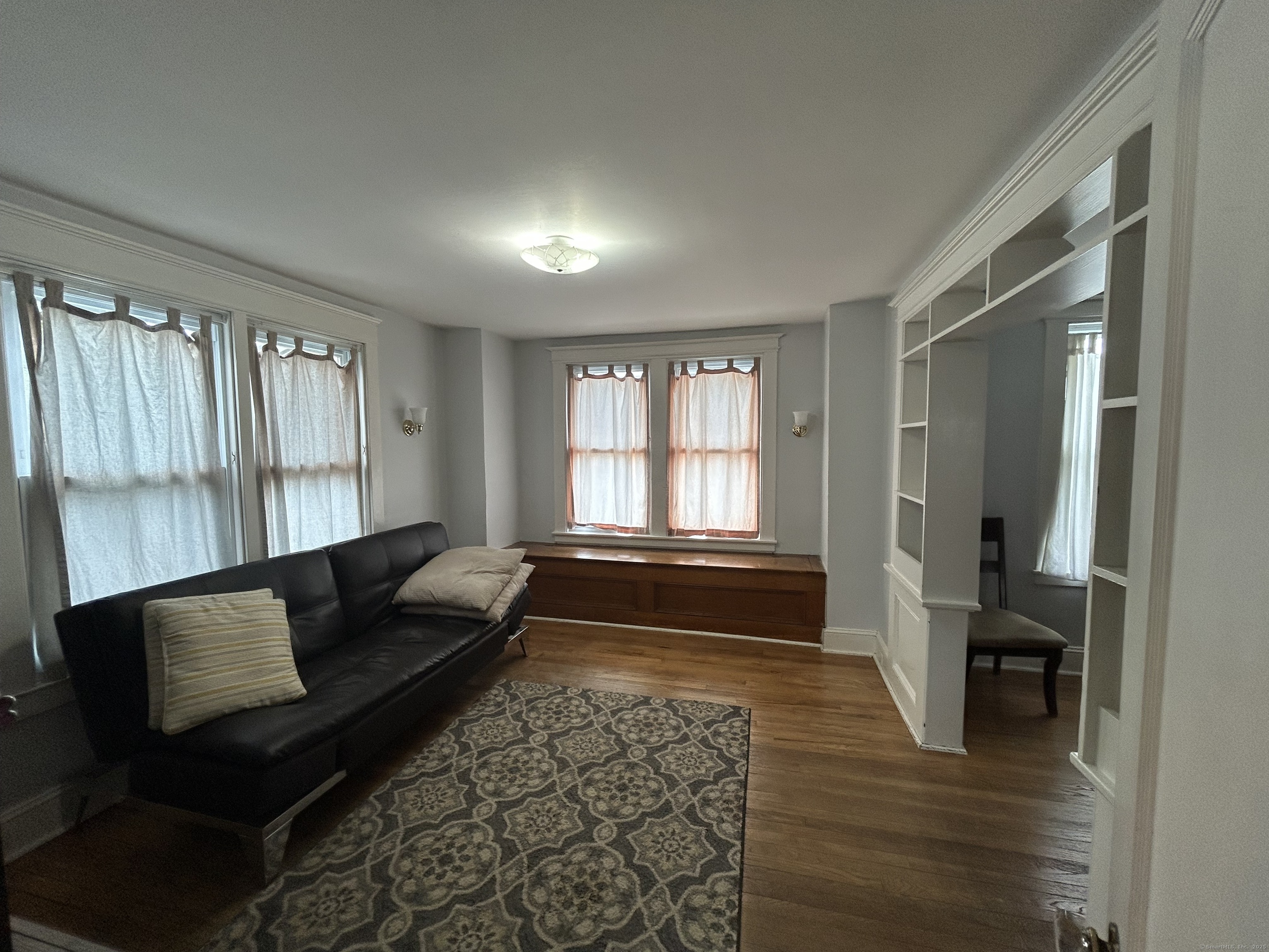 21 Acushnet Street Naugatuck, CT 06770 - Photo 5 of 27 a living room with furniture and a rug