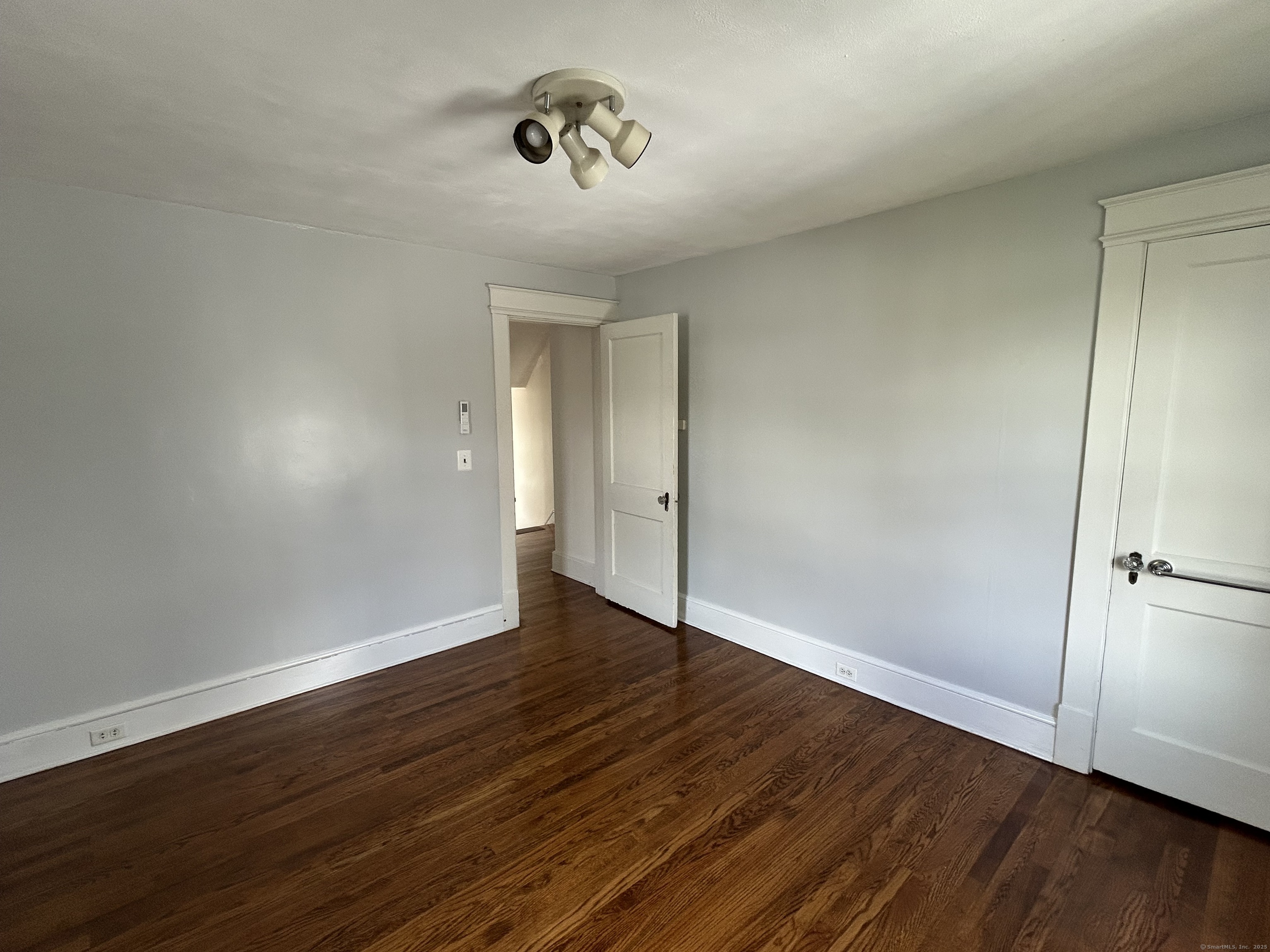21 Acushnet Street Naugatuck, CT 06770 - Photo 8 of 27 a view of an empty room with wooden floor