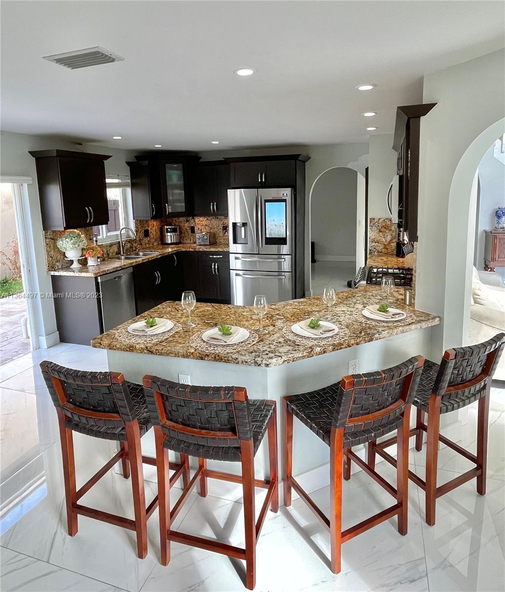 15542 Southwest 148th Terrace Miami, FL 33196 - Photo 13 of 38 a view of a dining room with furniture