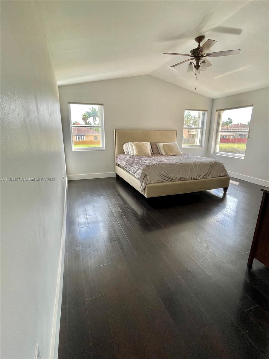 15542 Southwest 148th Terrace Miami, FL 33196 - Photo 27 of 38 a view of a bedroom with furniture and a window