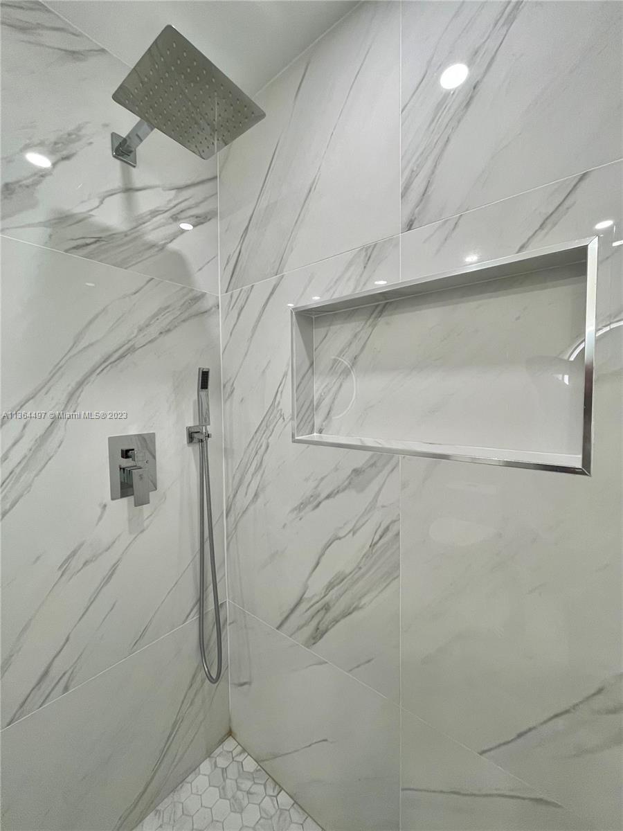 15542 Southwest 148th Terrace Miami, FL 33196 - Photo 31 of 38 a bathroom with a shower