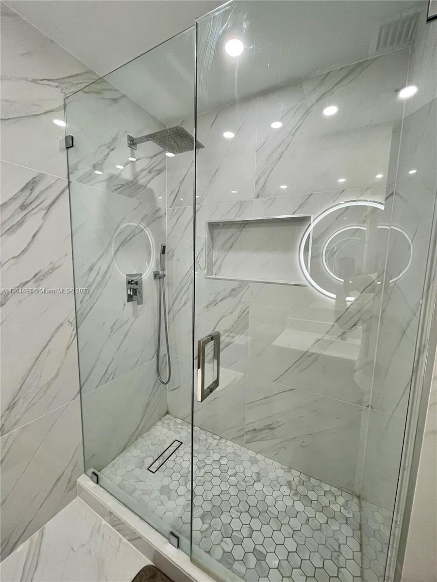 15542 Southwest 148th Terrace Miami, FL 33196 - Photo 32 of 38 a bathroom with a shower