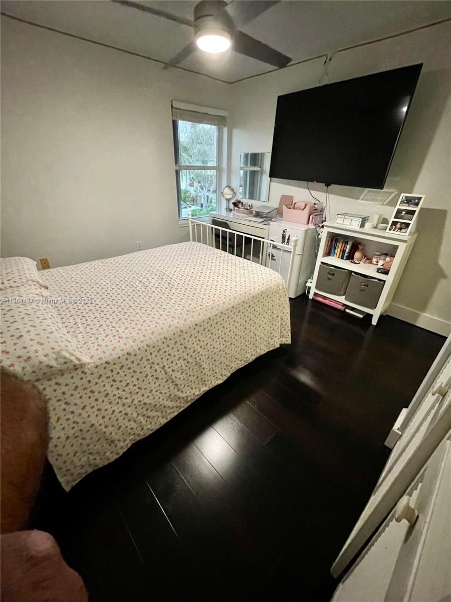 15542 Southwest 148th Terrace Miami, FL 33196 - Photo 37 of 38 a bed sitting in a bedroom next to a window