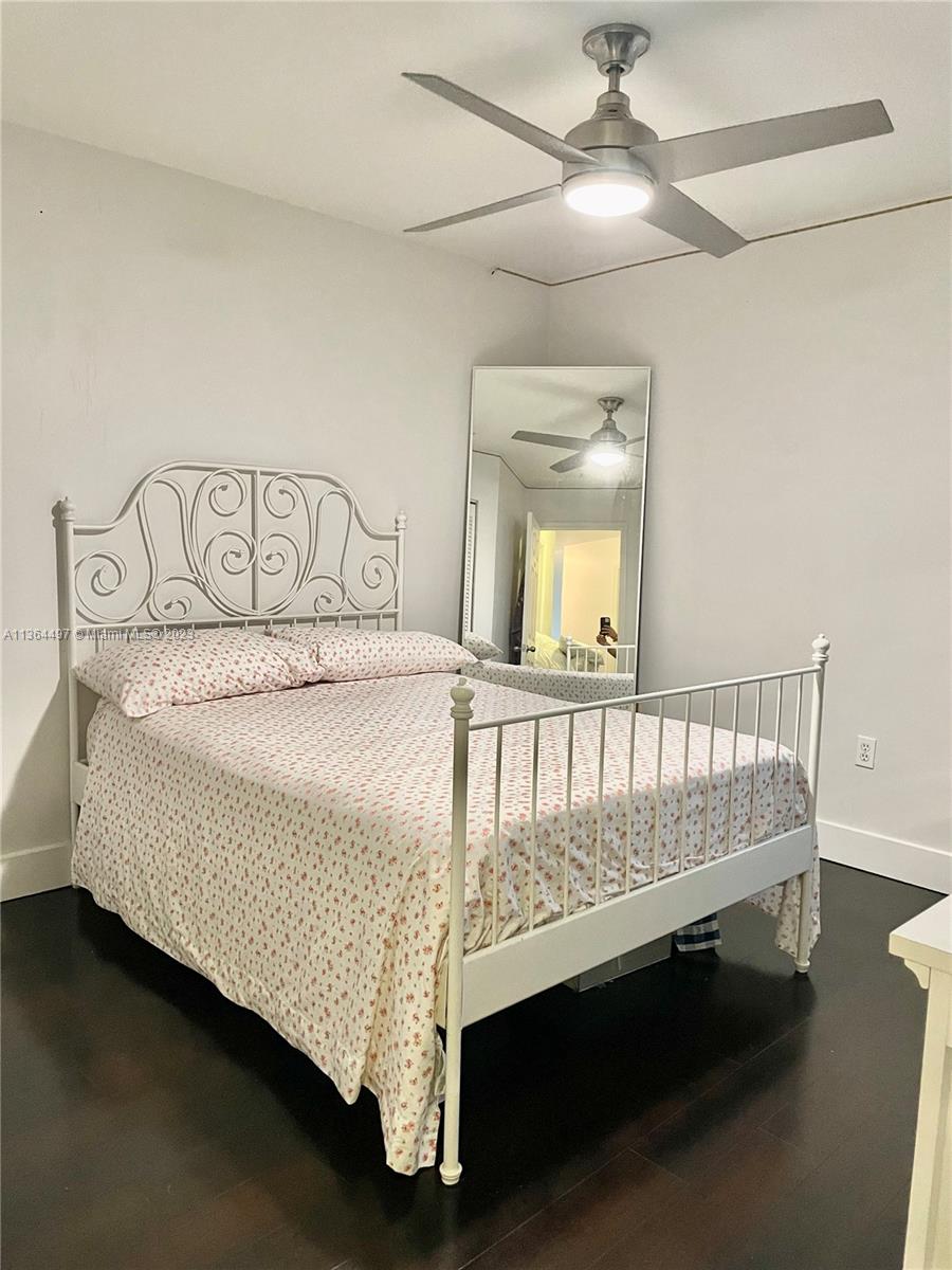15542 Southwest 148th Terrace Miami, FL 33196 - Photo 38 of 38 a bed sitting in a bedroom next to a window