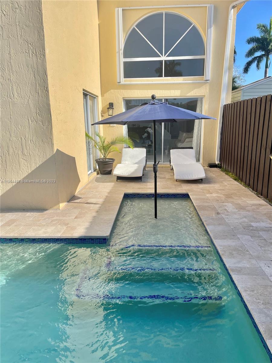 15542 Southwest 148th Terrace Miami, FL 33196 - Photo 10 of 38 a view of house with backyard and outdoor seating