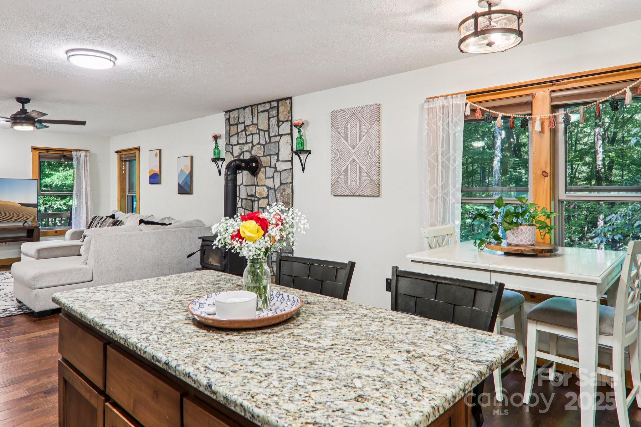 2171 Black Rock Road Cherokee, NC 28719 - Photo 12 of 36 a view of a dining room with furniture window and wooden floor