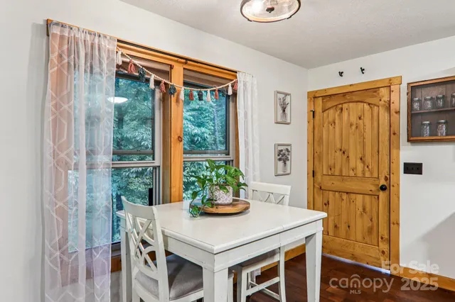 a view of kitchen island with furniture and refrigerator