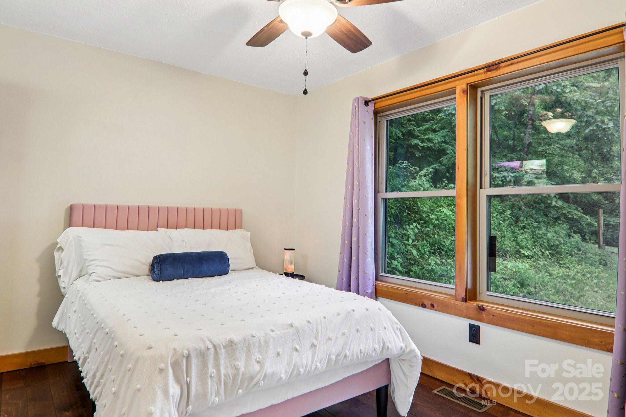2171 Black Rock Road Cherokee, NC 28719 - Photo 17 of 36 a bedroom with a bed and a large window