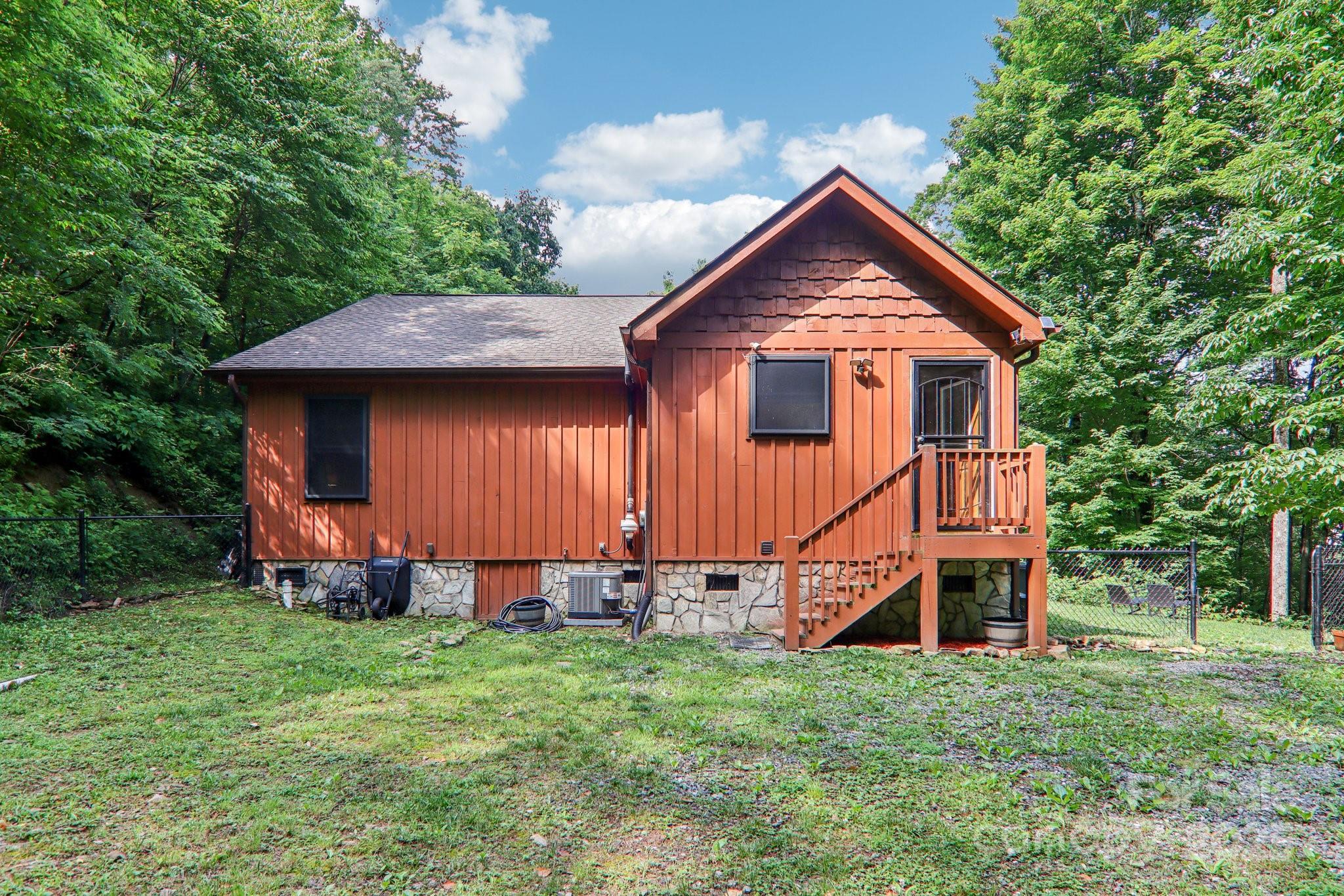 2171 Black Rock Road Cherokee, NC 28719 - Photo 28 of 36 a front view of a house with a yard and trees