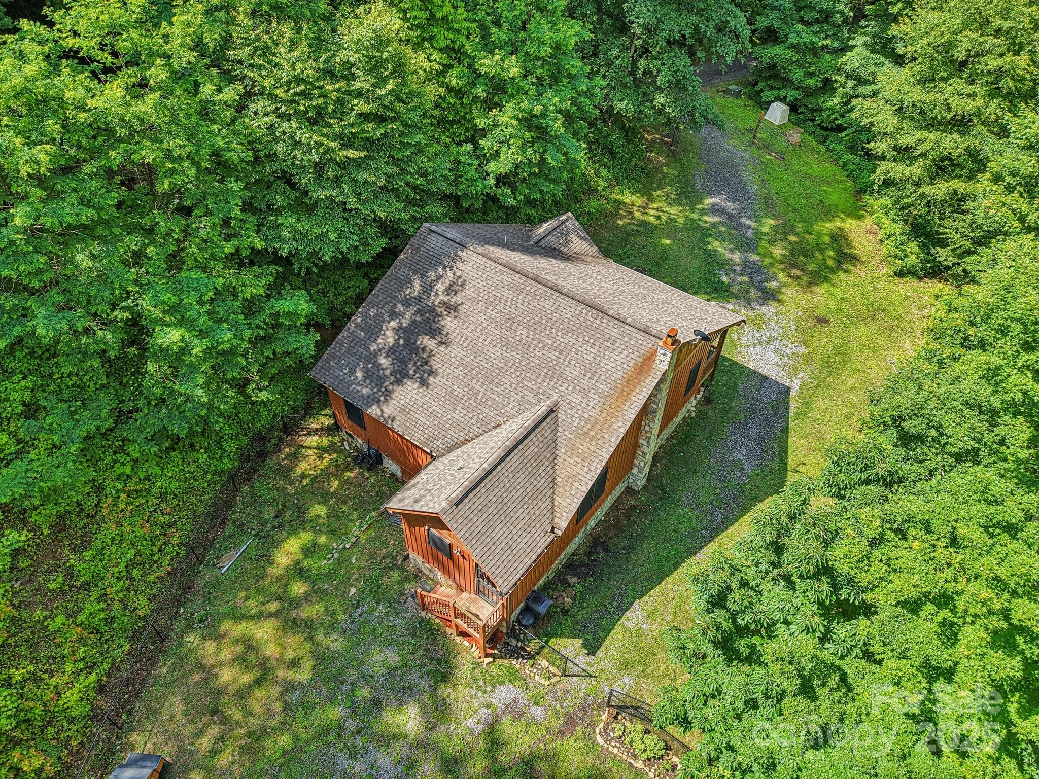 2171 Black Rock Road Cherokee, NC 28719 - Photo 29 of 36 an aerial view of a house with a yard and large trees