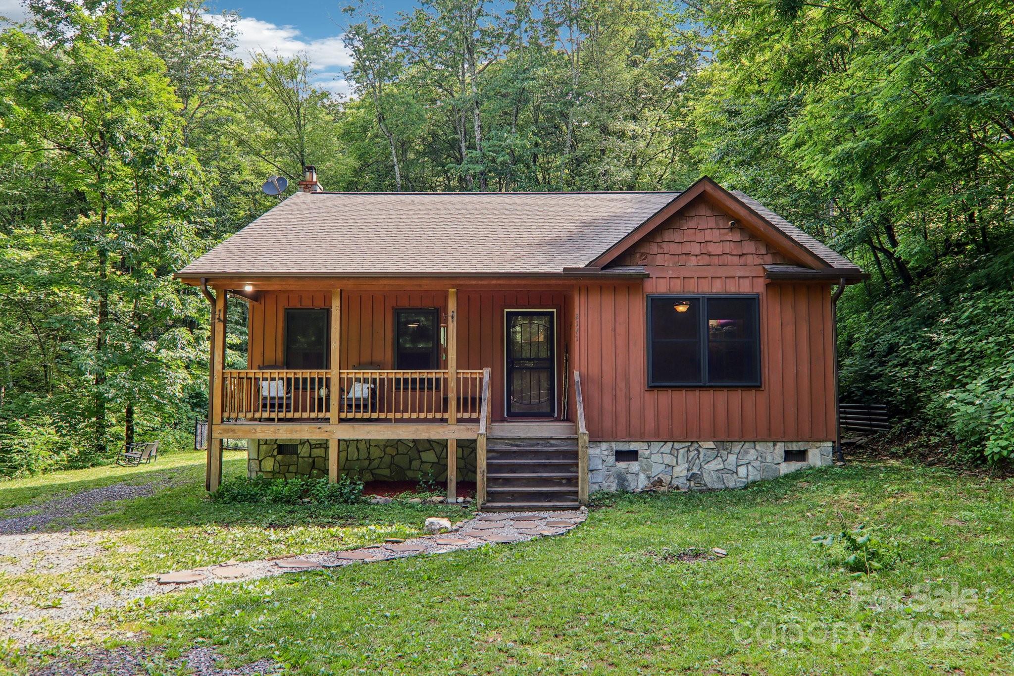 2171 Black Rock Road Cherokee, NC 28719 - Photo 3 of 36 a front view of a house with a garden