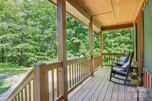 a view of a two chairs in the balcony