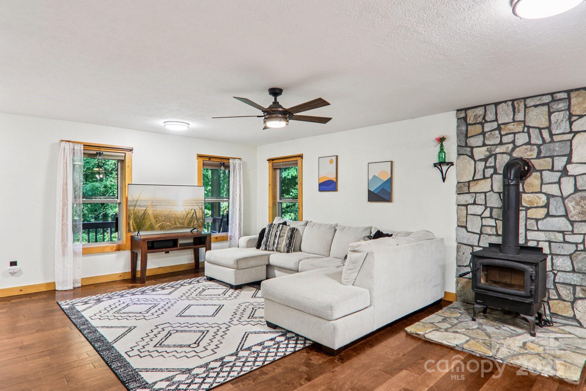 2171 Black Rock Road Cherokee, NC 28719 - Photo 8 of 36 a living room with furniture a rug and a table