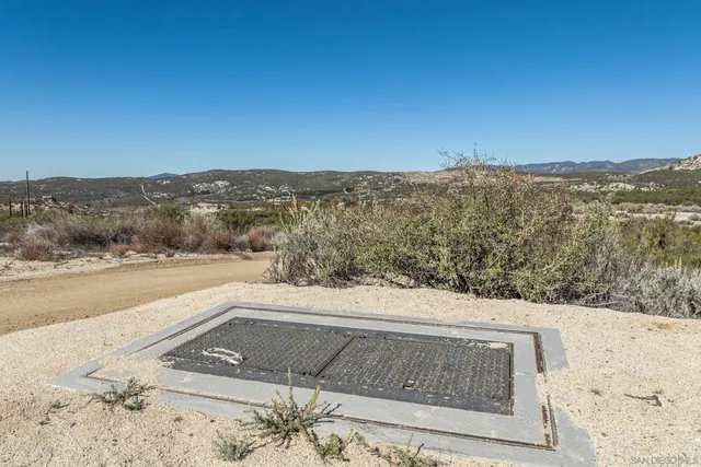 a view of a yard next to a building