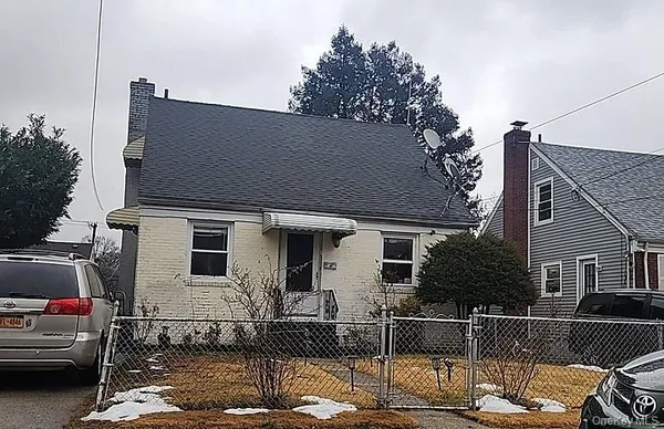a front view of a house with parking