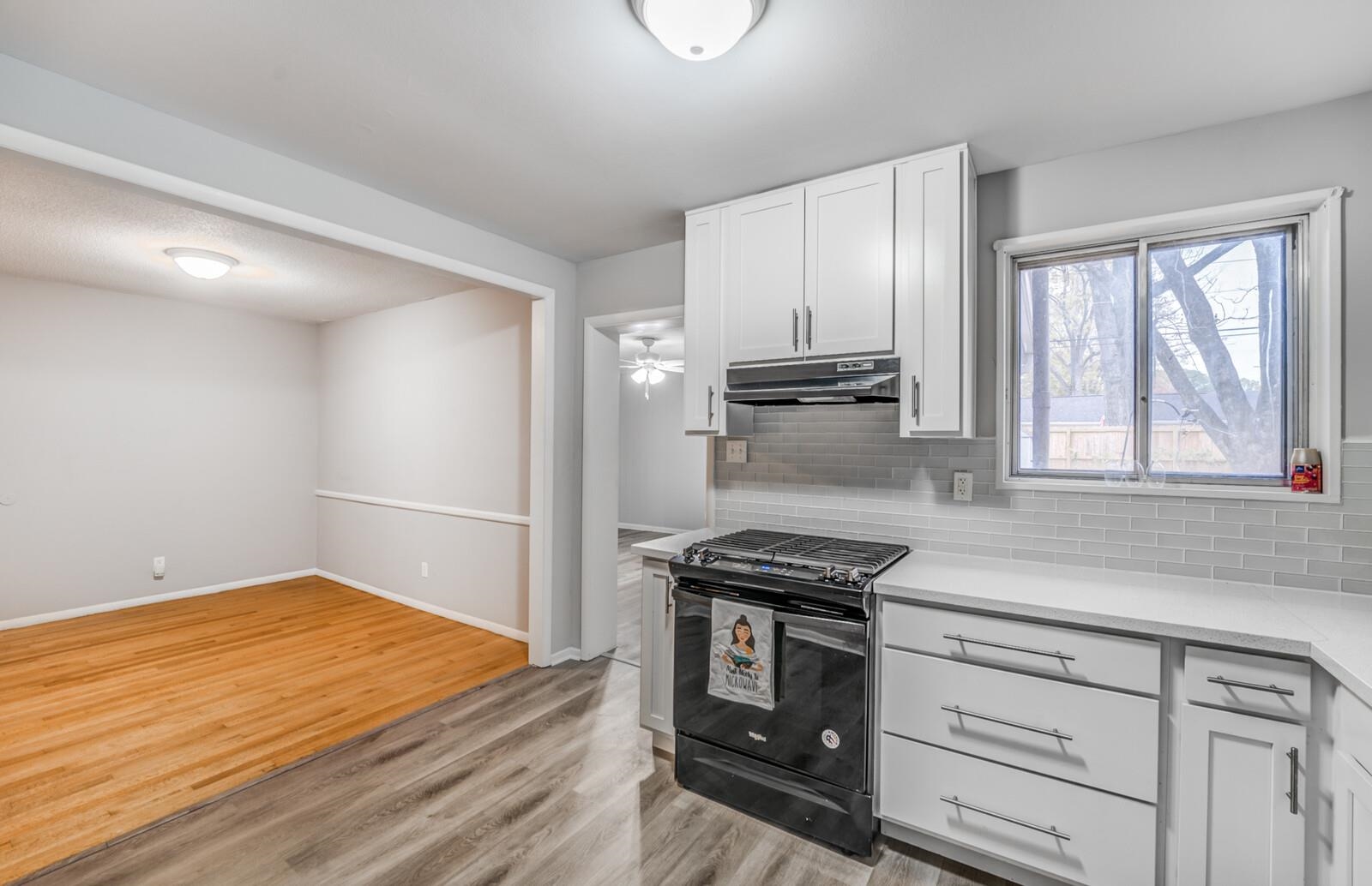512 Fleda Road Memphis, TN 38120 - Photo 13 of 26 a kitchen with stainless steel appliances a refrigerator and a stove top oven