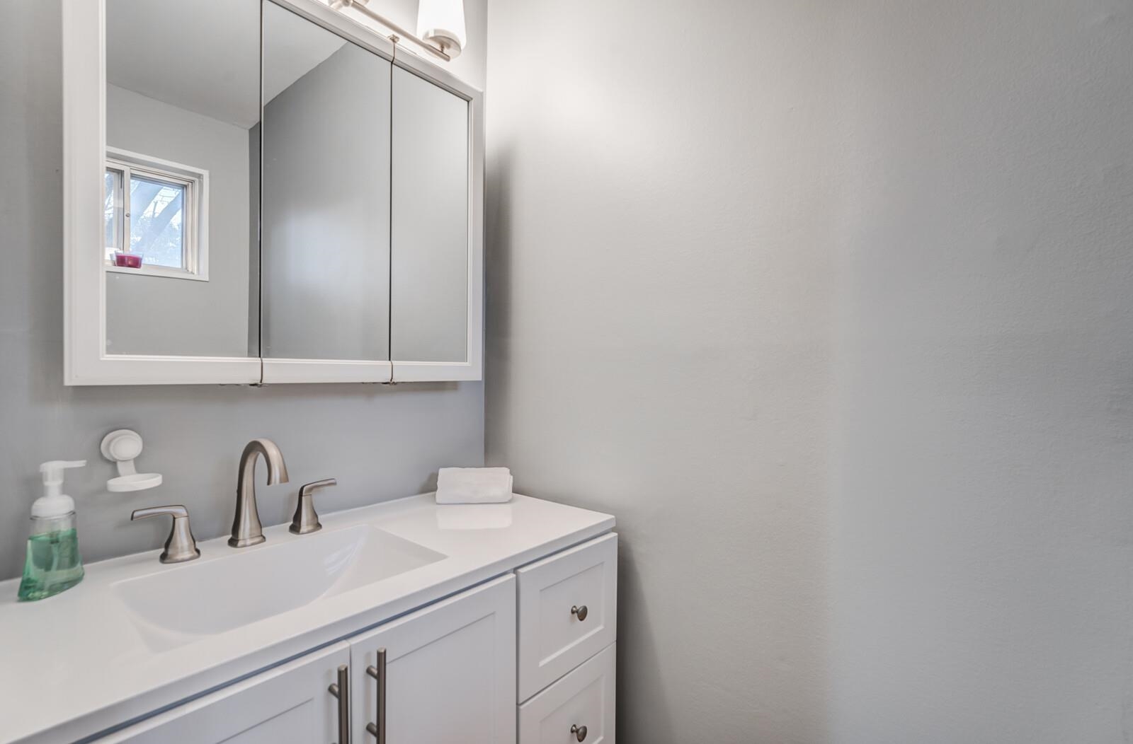 512 Fleda Road Memphis, TN 38120 - Photo 17 of 26 a view of a sink and cabinets