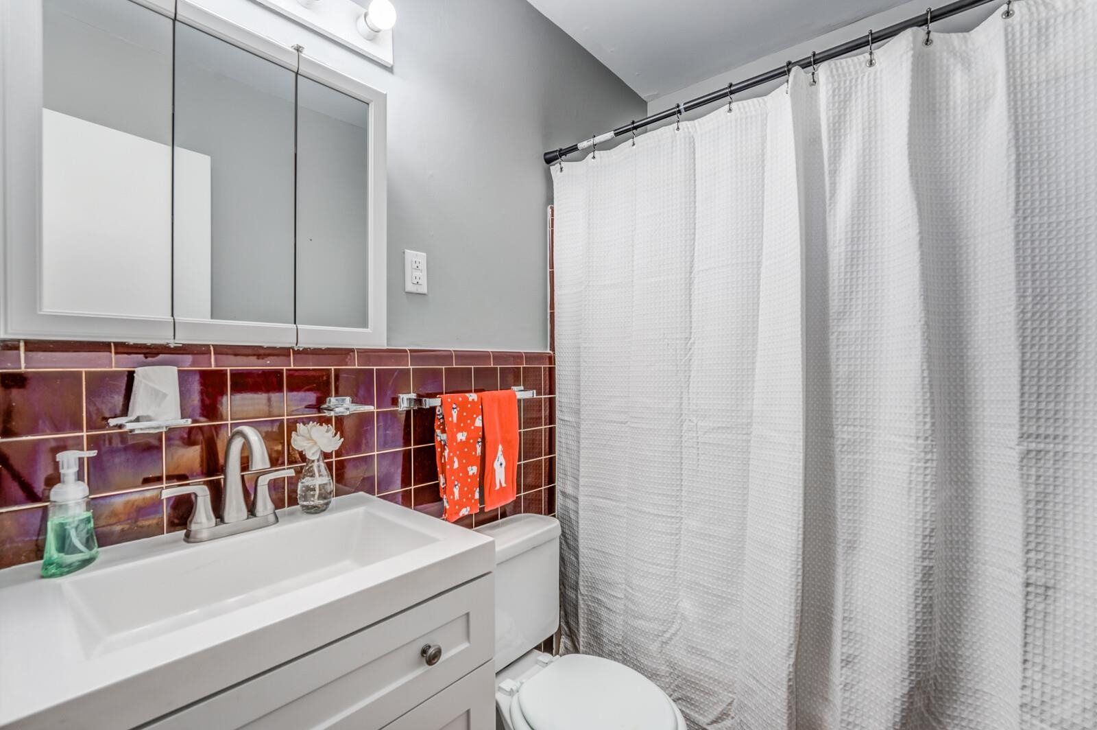 512 Fleda Road Memphis, TN 38120 - Photo 20 of 26 a bathroom with a sink and a mirror