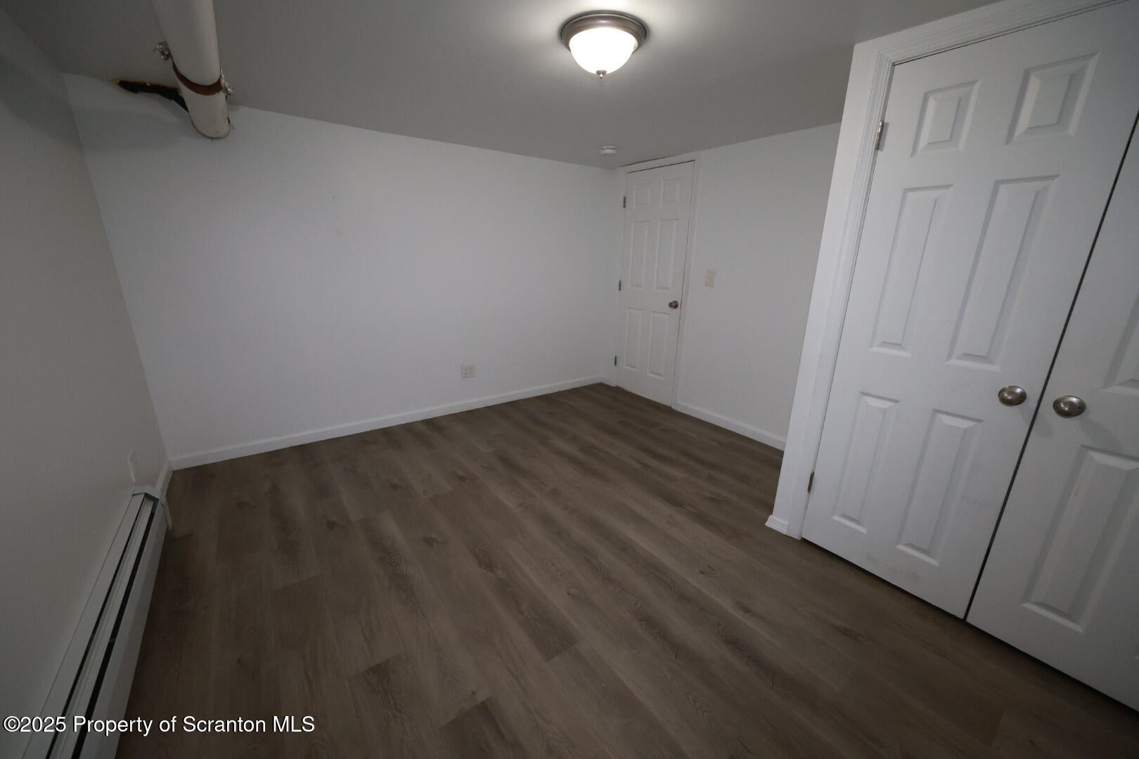 189 Nottingham Street, Unit 3 Plymouth, PA 18651 - Photo 12 of 14 an empty room with wooden floor