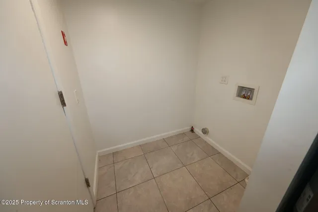 a white toilet sitting next to a shower curtain