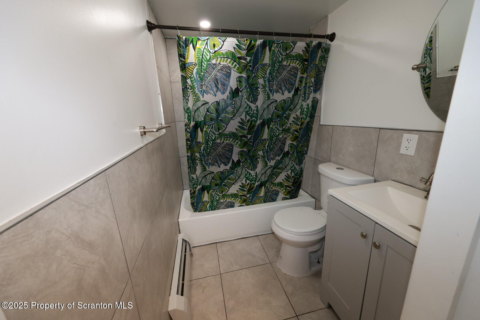 189 Nottingham Street, Unit 3 Plymouth, PA 18651 - Photo 14 of 14 a white toilet sitting next to a shower curtain