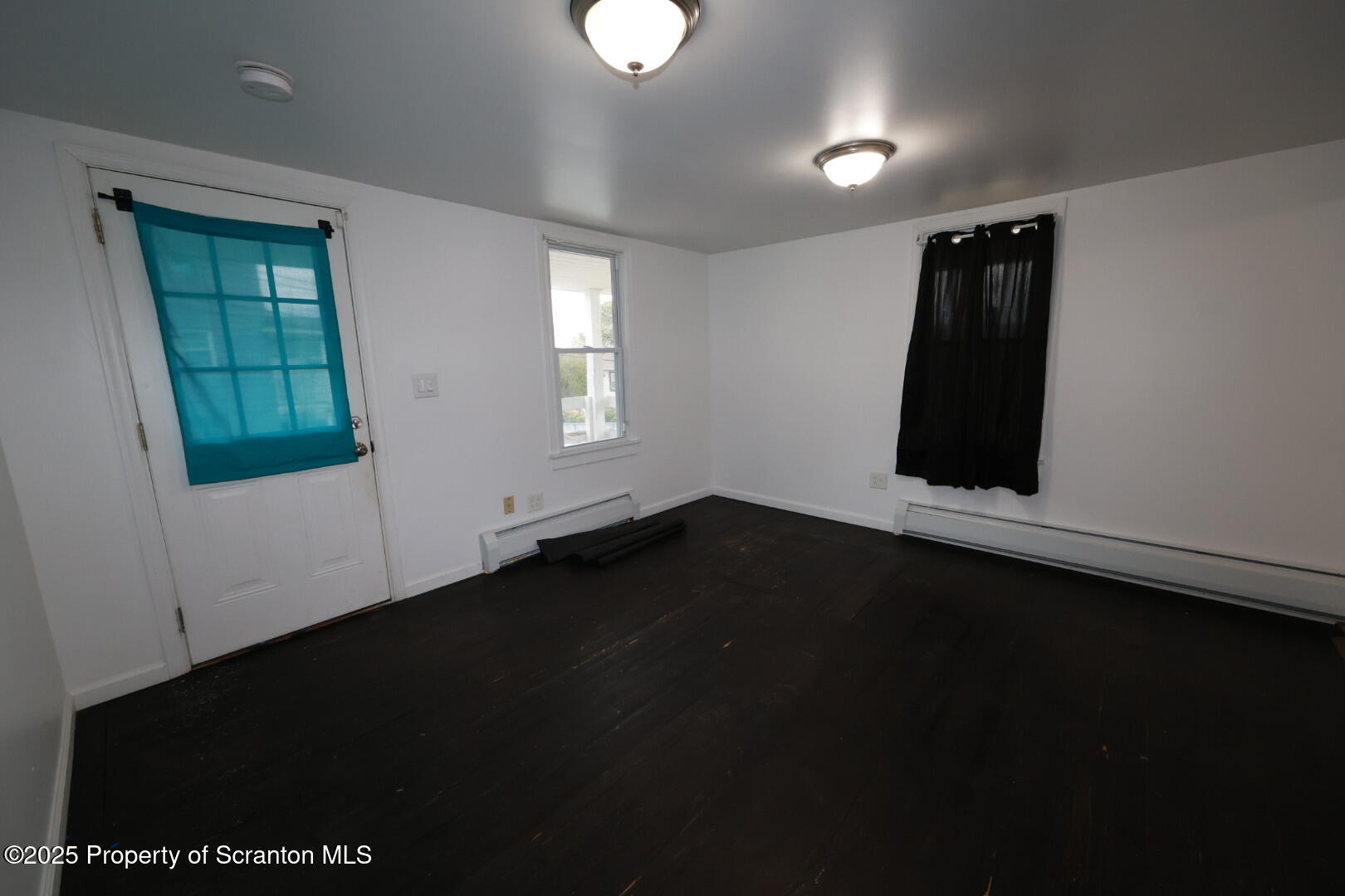 189 Nottingham Street, Unit 3 Plymouth, PA 18651 - Photo 6 of 14 wooden floor in an empty room with a window
