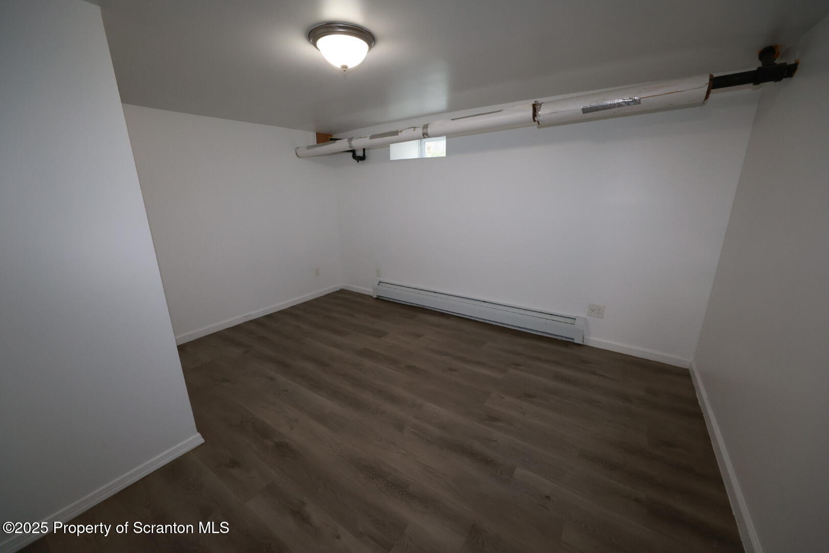 189 Nottingham Street, Unit 3 Plymouth, PA 18651 - Photo 10 of 14 an empty room with a workbench