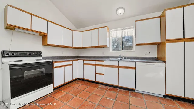 a view of a room with wooden floor and white walls