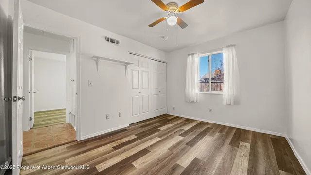 a bathroom with a granite countertop sink a toilet and bathtub