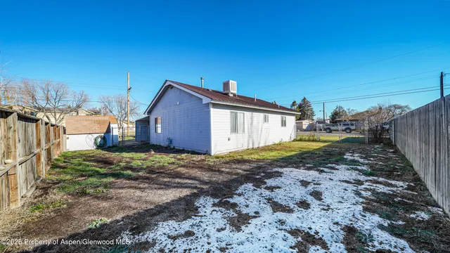 an aerial view of residential houses with outdoor space and river