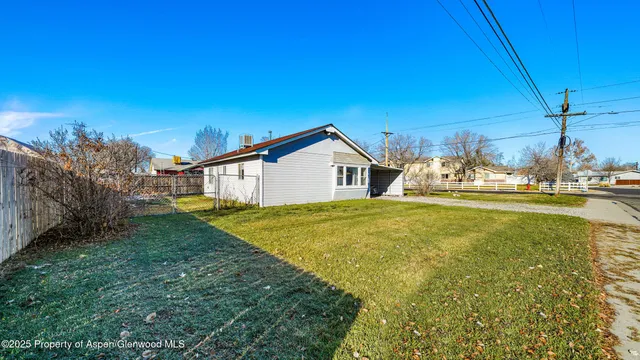 a house view with swimming pool in front of it