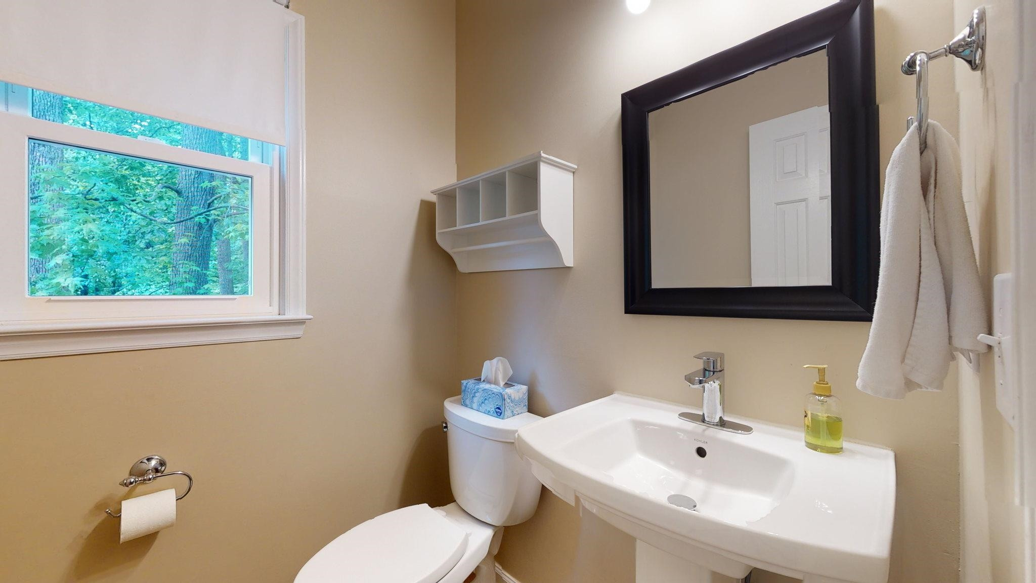 12205 Harcourt Drive Raleigh, NC 27613 - Photo 17 of 35 Updated 1/2 bathroom with comfort height commode and Kohler pedestal sink