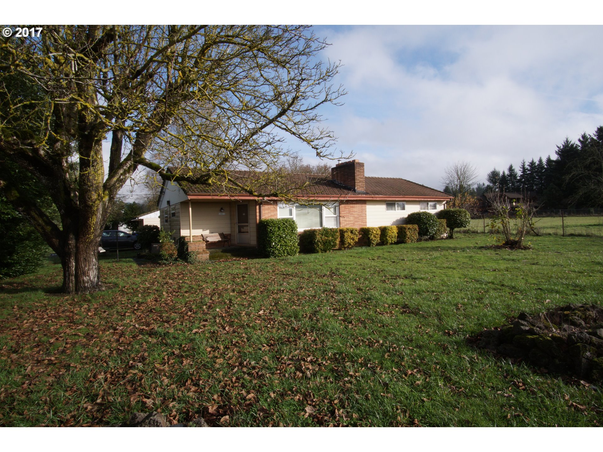 13311 South Macksburg Road Canby, OR 97013 - Photo 1 of 21 a front view of a house with a yard
