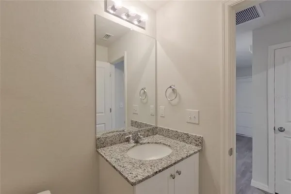 a bathroom with a shower and a toilet