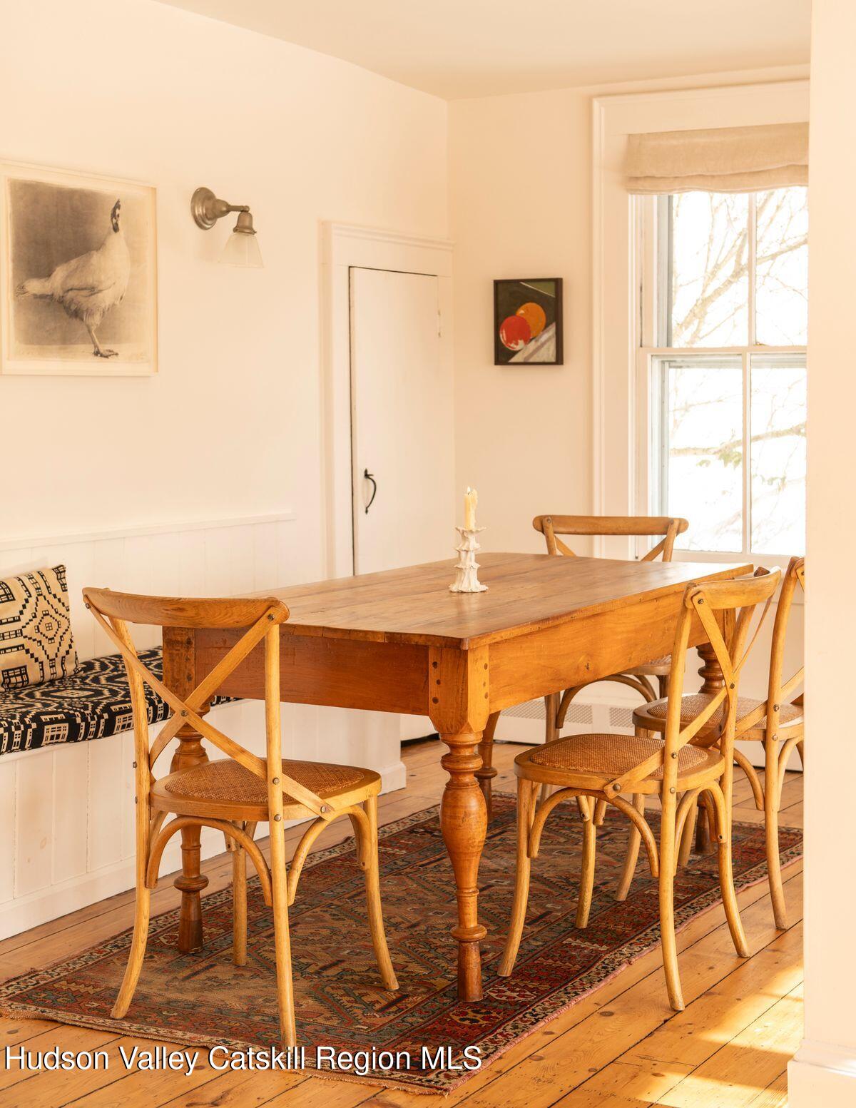 132 Decker Rd Pine Plains Ancram, NY 12502 - Photo 11 of 24 a view of a dining room with furniture and wooden floor