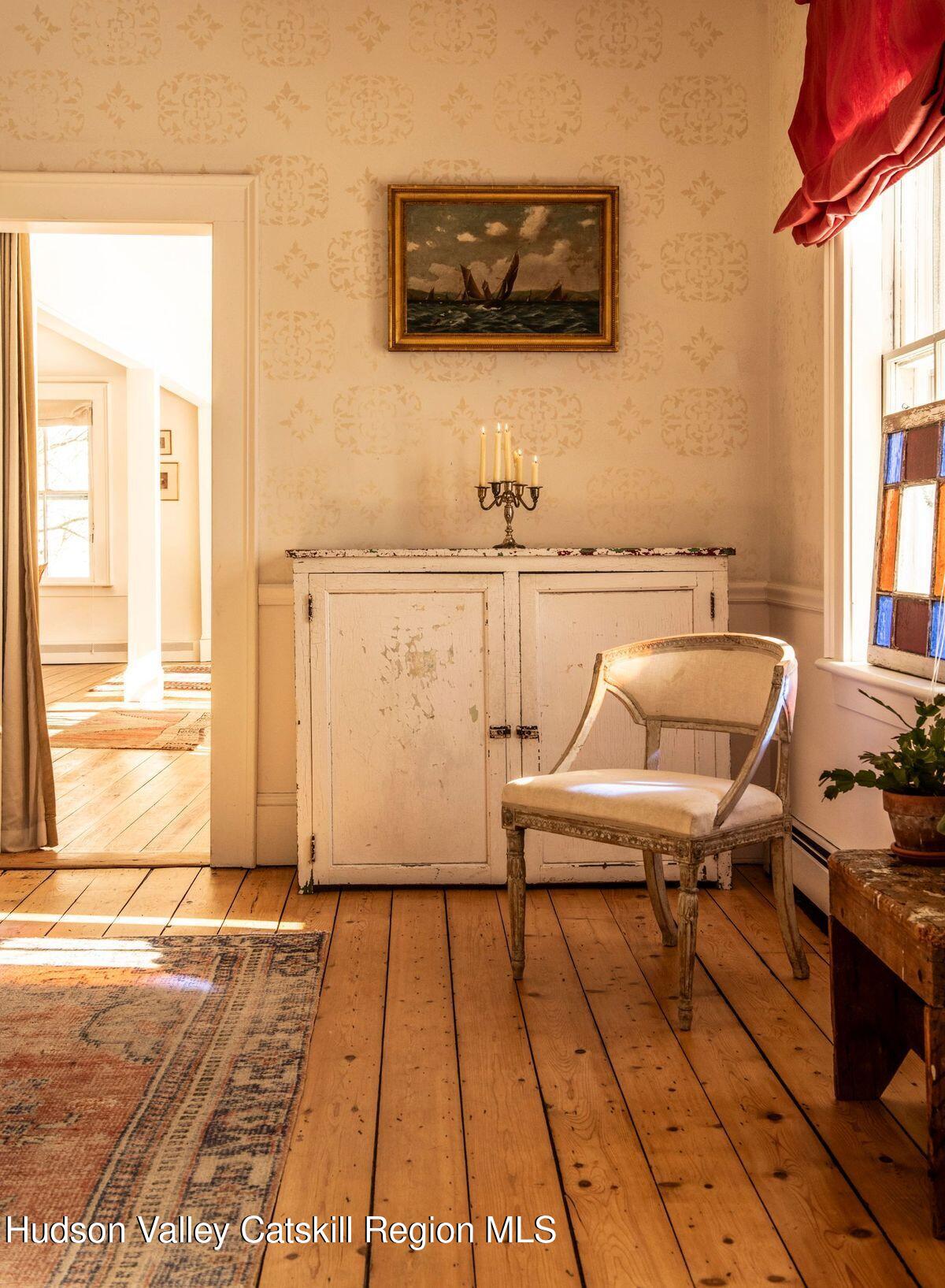132 Decker Rd Pine Plains Ancram, NY 12502 - Photo 12 of 24 a living room with a couch and a table