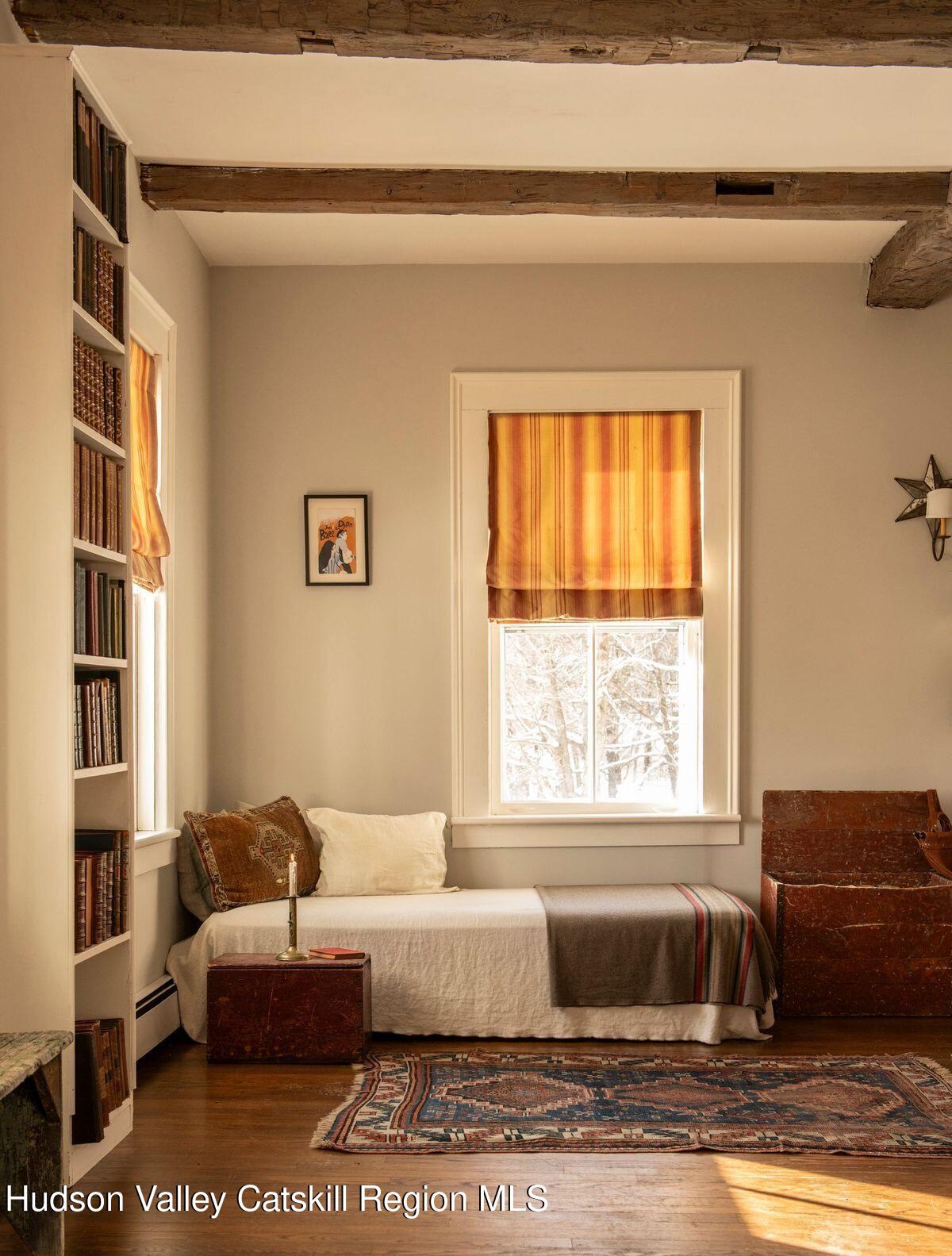 132 Decker Rd Pine Plains Ancram, NY 12502 - Photo 14 of 24 a living room with a couch and a window