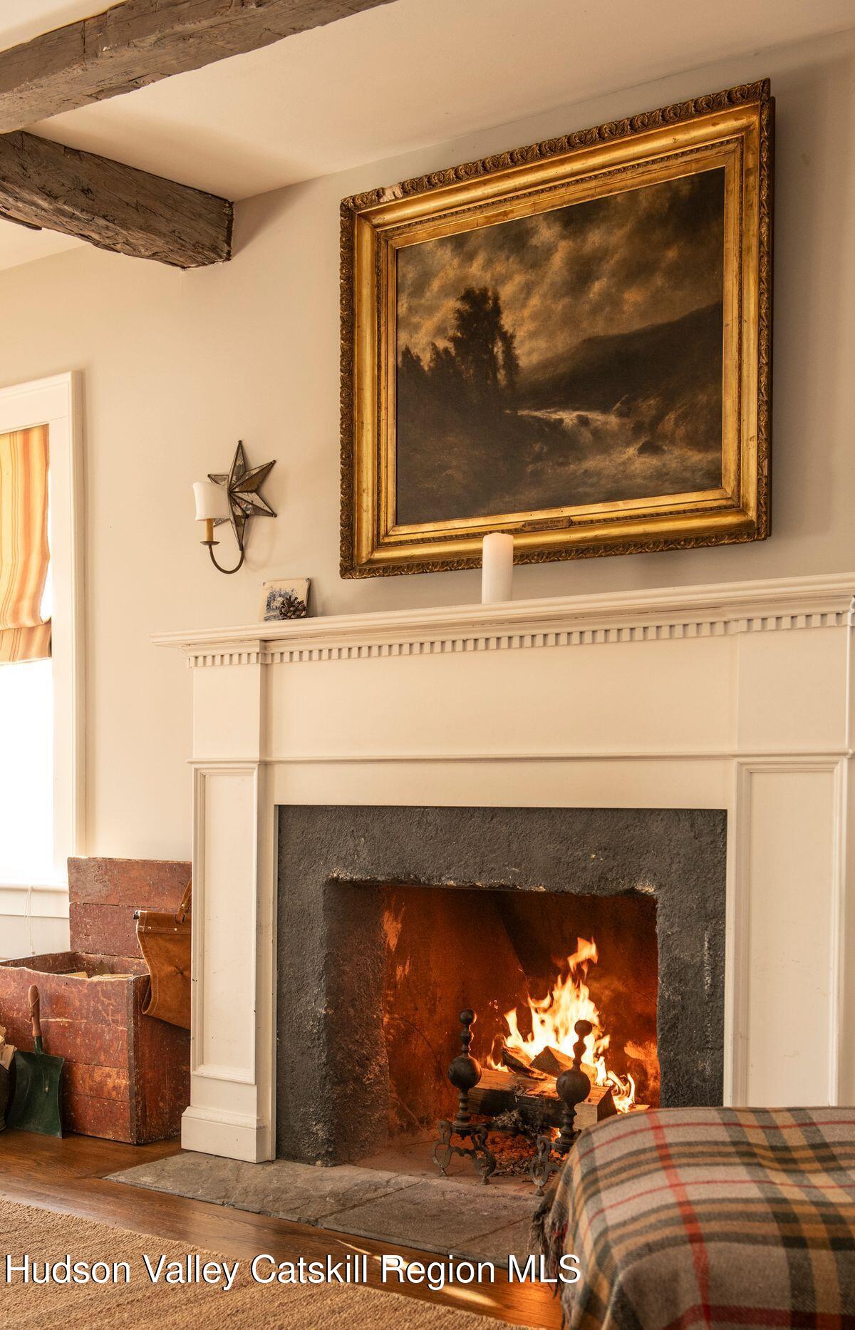 132 Decker Rd Pine Plains Ancram, NY 12502 - Photo 16 of 24 a living room with a fireplace and a fireplace