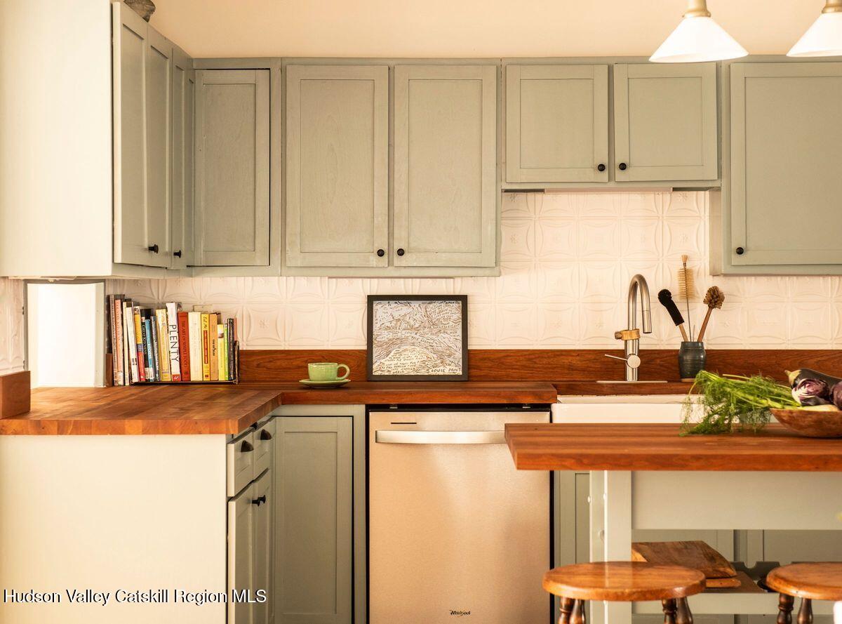 132 Decker Rd Pine Plains Ancram, NY 12502 - Photo 9 of 24 a kitchen with stainless steel appliances granite countertop a refrigerator a sink and white cabinets