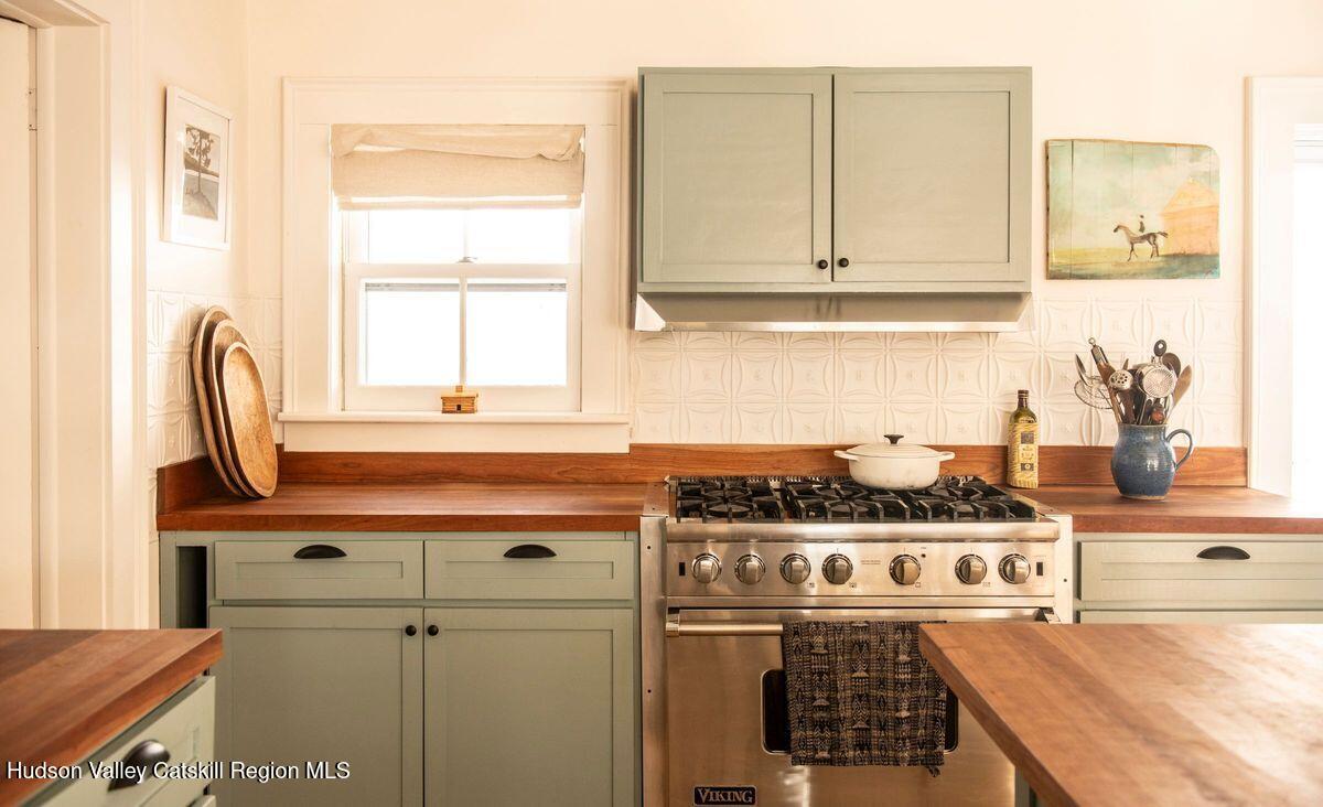 132 Decker Rd Pine Plains Ancram, NY 12502 - Photo 10 of 24 a kitchen with stainless steel appliances granite countertop a stove and a microwave
