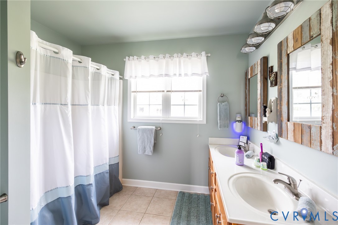 768 Hardtimes Road Farmville, VA 23901 - Photo 54 of 56 Bathroom with a double vanity featuring integrated