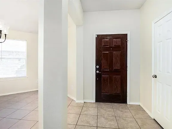 a view of a closet area with living room