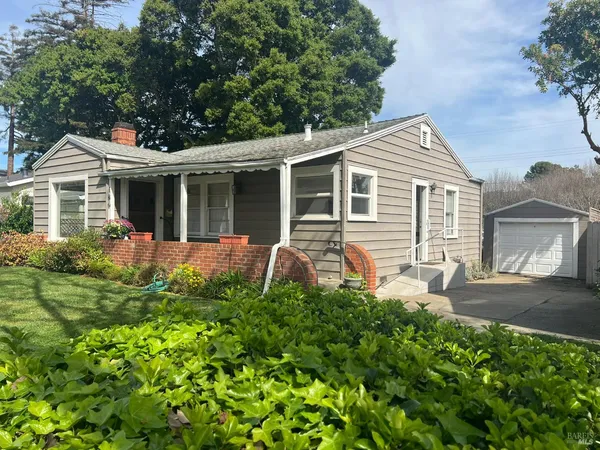 front view of a house with a yard